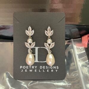 Poetry designs earrings,silver,pearl & cubic zirconia.